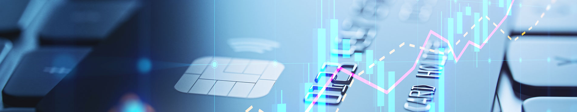 Nahaufnahme einer Kreditkarte auf einer Tastatur, mit Finanzdiagrammen, die Dynamik und Technologie ausstrahlen.