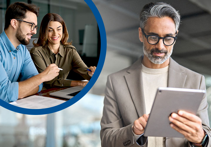 Drei Personen in einem modernen Büro, die konzentriert arbeiten und engaged wirken.